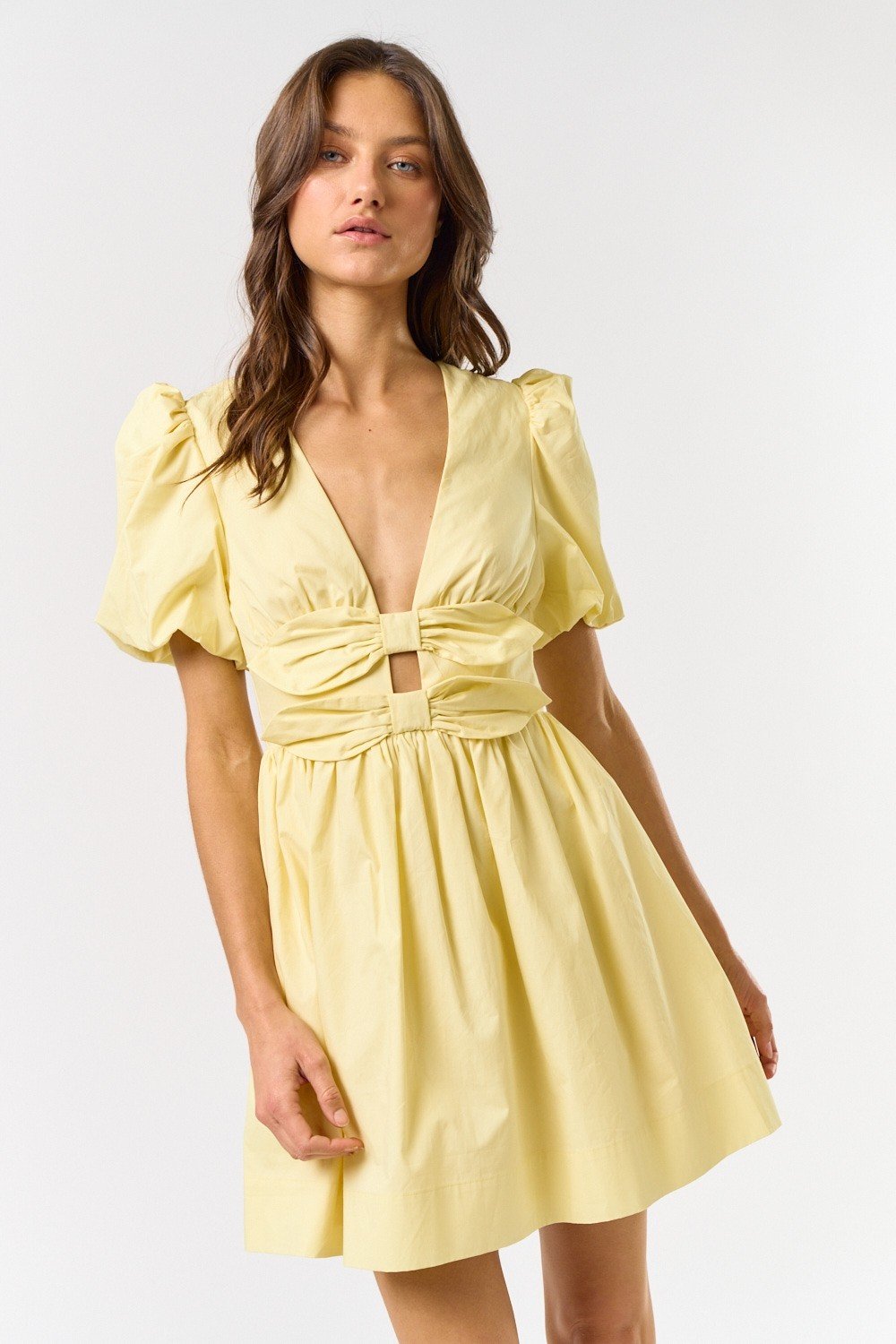 Melissa Dress in lemon yellow, featuring puff sleeves and a cinched waist. Perfect for beach outings and coastal boutique fashion.