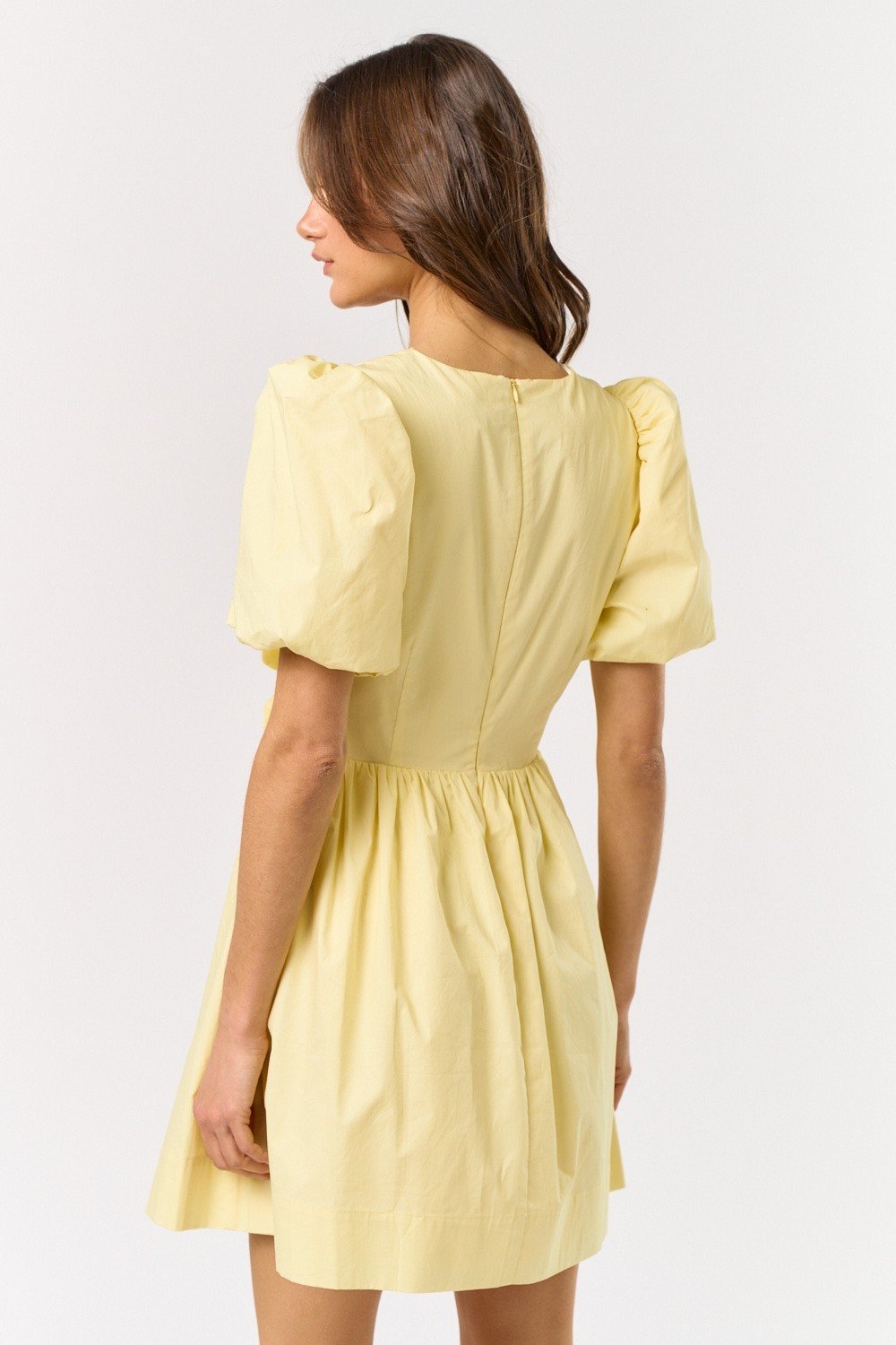 Melissa Dress in vibrant lemon hue with puff sleeves, perfect for coastal boutique clothing and beach dresses.