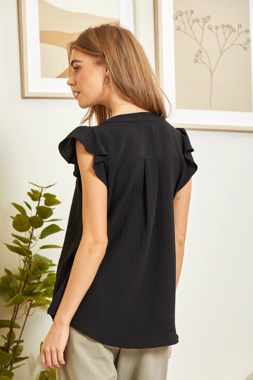 Back view of a stylish Black Top from Raggdoll Boutique, perfect for summer outfits Texas and trendy coastal style.