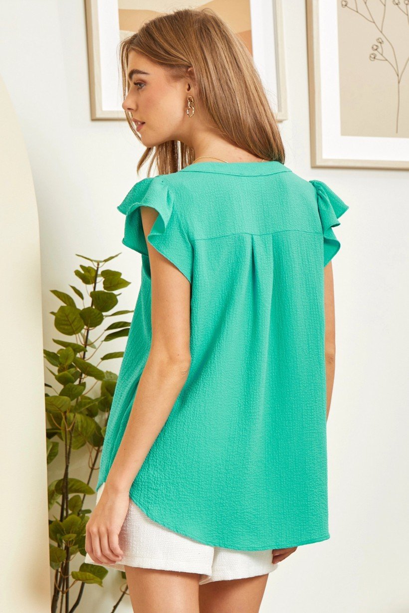 Emerald Green Top from Raggdoll Boutique, trendy coastal style perfect for summer outfits in Port Aransas.
