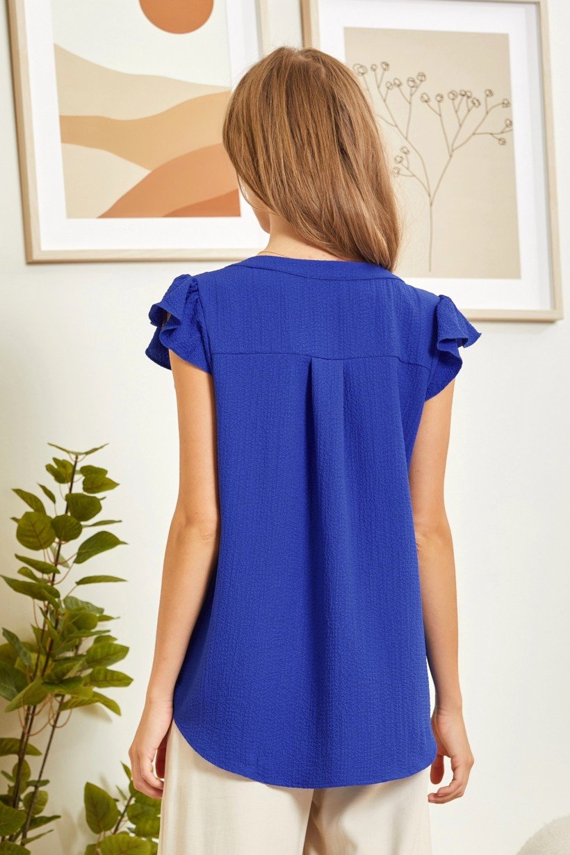 Back view of ROYAL BLUE FLUTTER TOP from Raggdoll Boutique, perfect for trendy coastal style and summer outfits Texas.