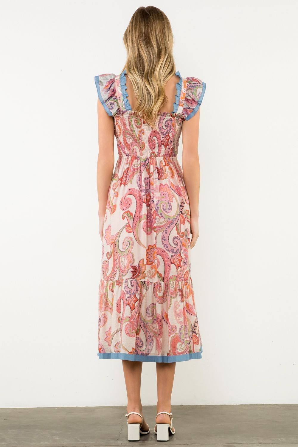 Back view of Molly Dress with colorful paisley print, perfect for coastal boutique clothing and tropical vacations.