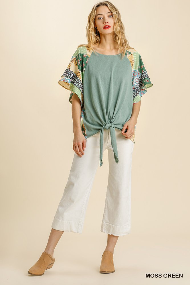GREEN PRINT HEATHER KNIT TOP WITH TIE AT WAIST modeled with white pants, available at Raggdoll Boutique.