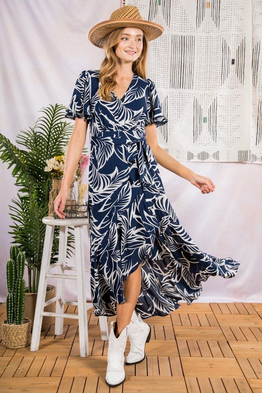 SUN KISSED MIDI IN NAVY tropical leaf printed maxi dress from Raggdoll Boutique, trendy coastal style dress.