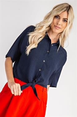 NAVY TOP WITH FRONT DETAIL styled with a red skirt, perfect for trendy coastal style at Raggdoll Boutique.