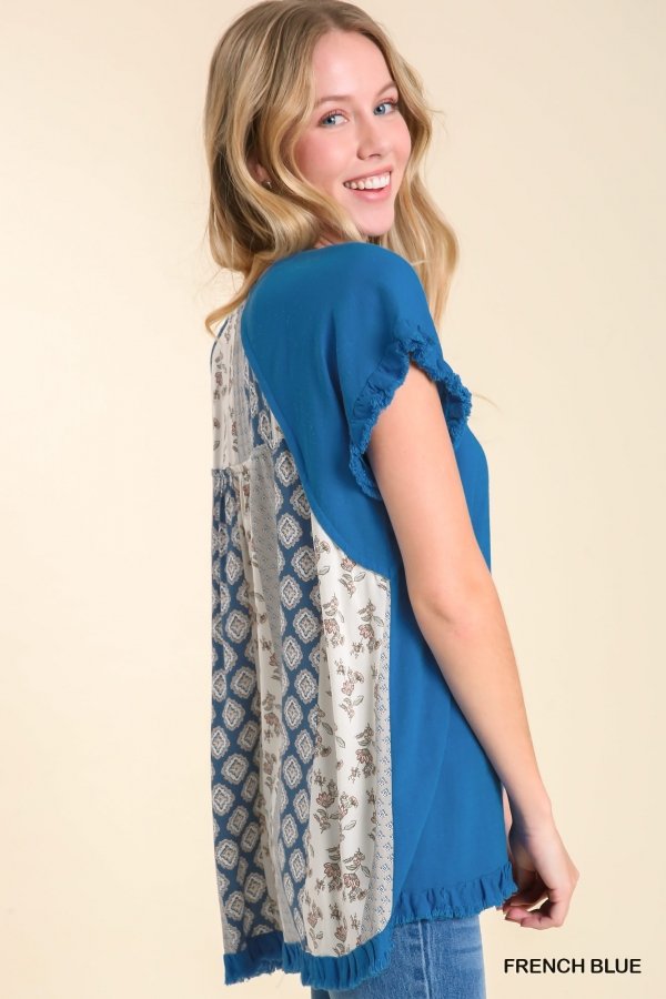 French blue top with decorative contrast back, perfect for coastal boutique clothing and chic Port Aransas style.