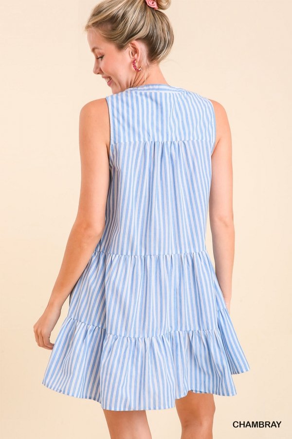 Back view of the PRETTY AS A PICTURE DRESS, featuring a tiered design in blue stripes from Raggdoll Boutique.