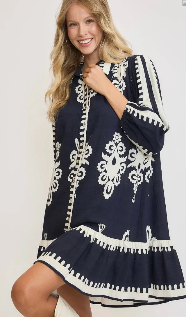 Stylish navy dress with white pattern, ideal for coastal boutique clothing and tropical vacations, perfect for women's fashion.