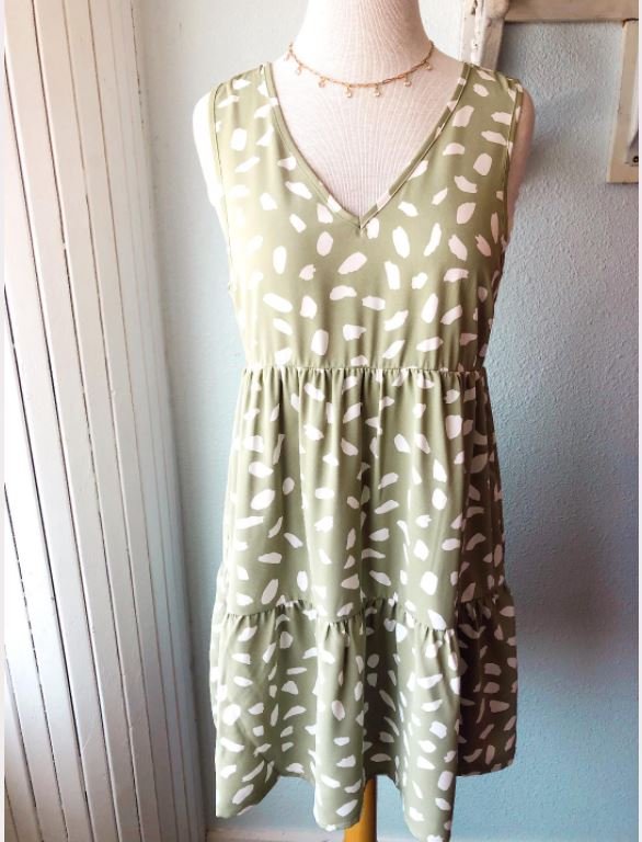 SAGE AND WHITE PRINT DRESS WITH BACK DETAIL displayed on a mannequin at Raggdoll Boutique.