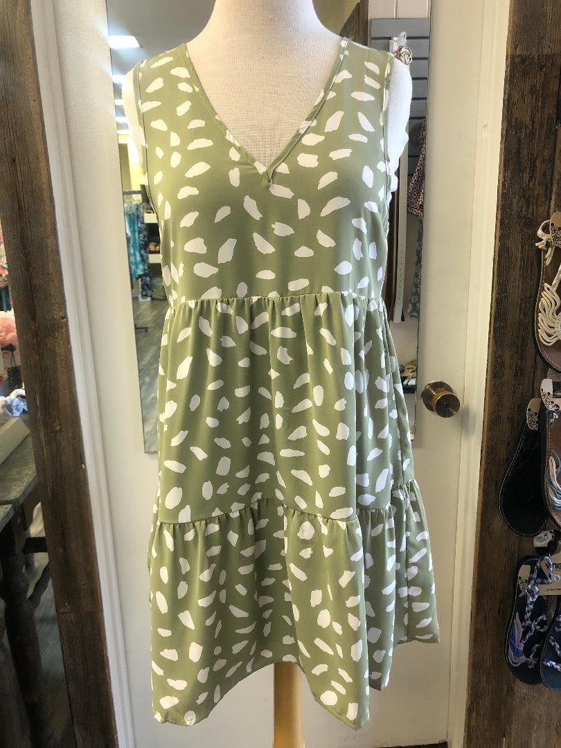 PERFECTLY PLAYFUL SAGE AND WHITE DRESS showcased at Raggdoll Boutique in Port Aransas.
