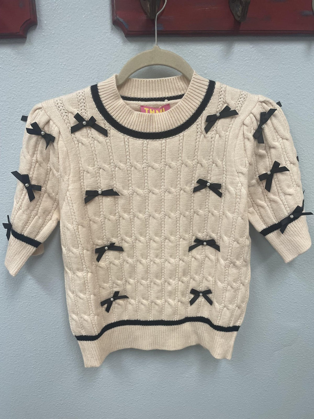 THML cream sweater with bow details, perfect for coastal boutique clothing and curated women's fashion. Ideal gift for tropical vacations.