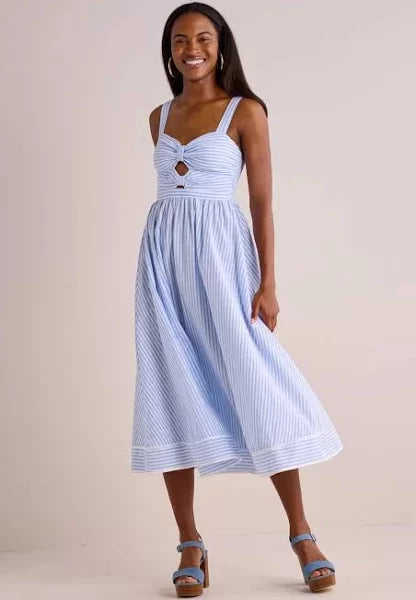 Beyond the Sea Dress showcasing charming bow details and cutouts, perfect for summer outfits from Raggdoll Boutique.
