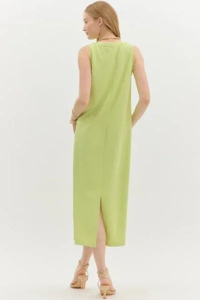 Back view of a lime green ribbed sleeveless midi dress with a back slit, perfect for coastal boutique clothing.