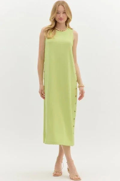 Lime green sleeveless midi dress with gold-button details, perfect for coastal boutique clothing and tropical vacations.