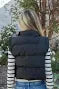 Black cropped vest with bow side detail, perfect for coastal boutique clothing and stylish tops for women.