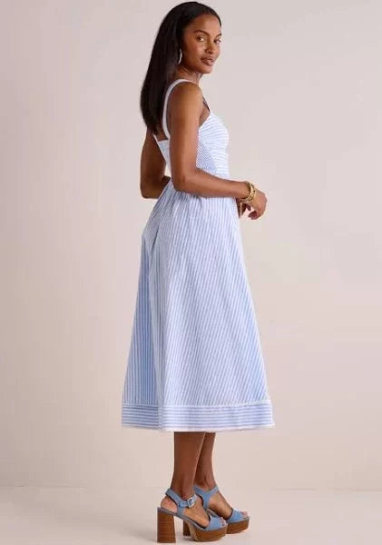 Beyond the Sea Dress showcasing charming bow details and cutouts, perfect for trendy coastal style from Raggdoll Boutique.