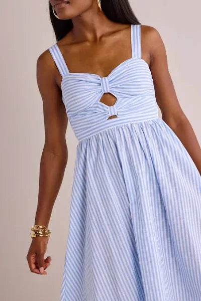 Beyond the Sea Dress from Raggdoll Boutique featuring bow details and peek-a-boo cutouts in blue and white stripes.