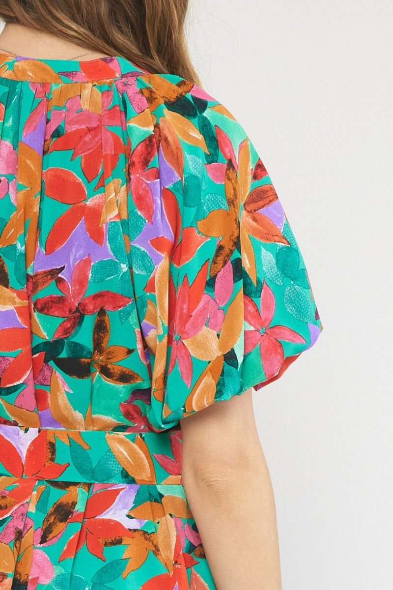 GREEN MULTI FLORAL ROMPER from Raggdoll Boutique showcasing vibrant floral patterns for trendy coastal style.