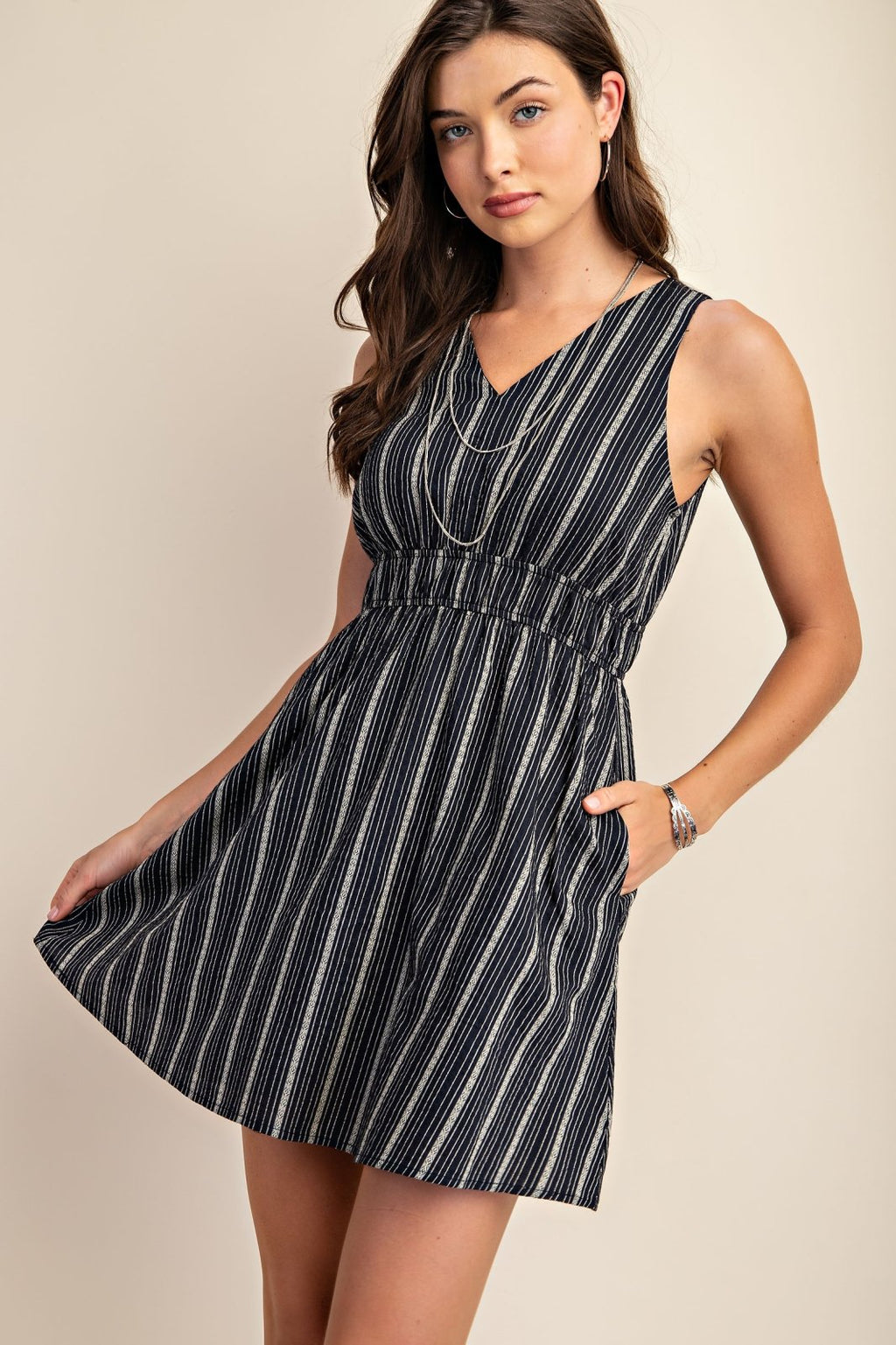 Contemporary striped dress from a Port Aransas boutique, perfect for beach outings and summer styling with sneakers.
