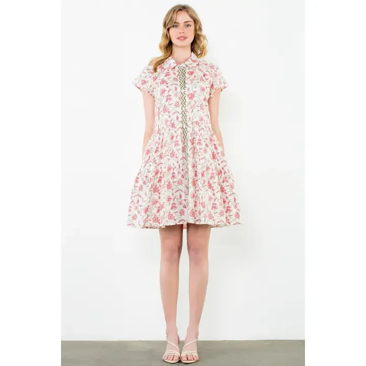 Cream floral button-up dress from a coastal boutique, perfect for beach outings and styled for Port Aransas vacations.