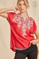 PLUS RED EMBROIDERED SAVANNA JANE TOP worn with black pants, available at Raggdoll Boutique for trendy coastal style.