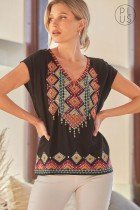Model wearing PLUS EMBROIDERED SAVANNA JANE TOP from Raggdoll Boutique, showcasing trendy coastal style.
