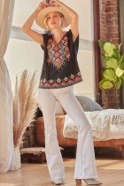 PLUS EMBROIDERED SAVANNA JANE TOP on model in trendy coastal style, wearing wide-leg pants and a hat, perfect for summer outfits Texas.