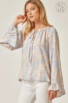 PLUS LIGHT BLUE FLORAL TOP from Raggdoll Boutique, perfect for a trendy summer outfit in Port Aransas.