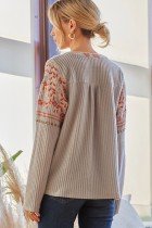 Woman wearing SAVANNA JANE GREY/RUST TOP, ideal for coastal fashion and summer outfits Texas.