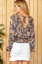 NAVY FLORAL TOP WITH BOW ON BACK showcased at Raggdoll Boutique in Port Aransas, perfect for trendy coastal style.