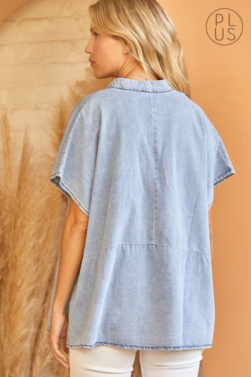 Stylish woman wearing a PLUS LIGHT DENIM TOP, perfect for summer outfits Texas at Raggdoll Boutique.