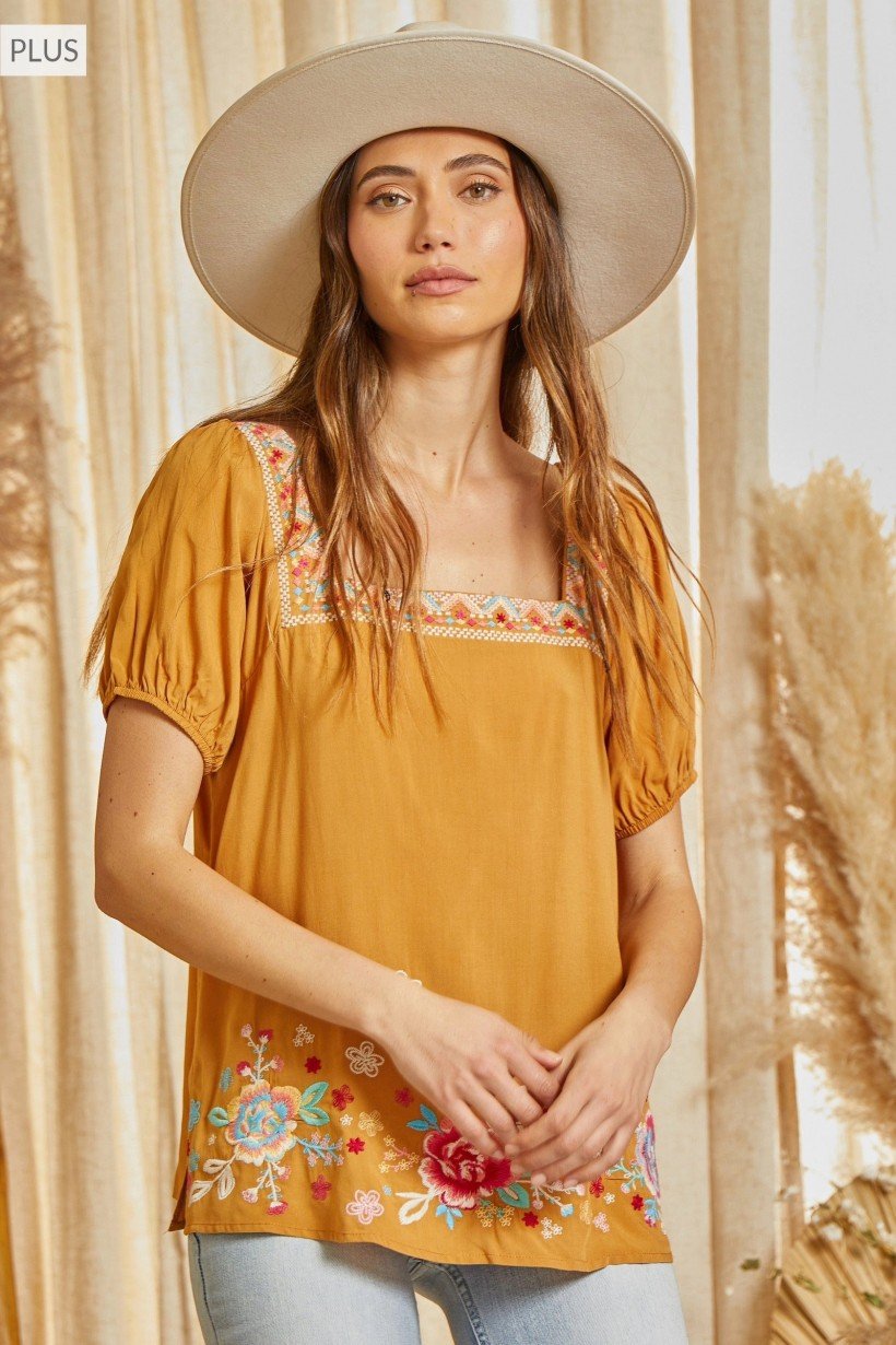 Savanna Jane Marigold Embroidered Top featured in trendy coastal style at Raggdoll Boutique, Port Aransas.