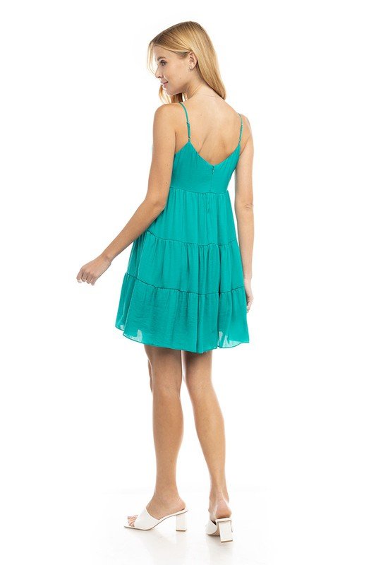 Back view of the TEAL A KISS DRESS, a trendy coastal style from Raggdoll Boutique, perfect for summer outfits.