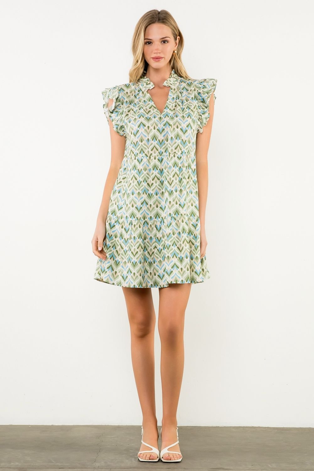 Miller Dress featuring flutter sleeves, floral print, perfect for brunch or garden parties, from a coastal boutique.
