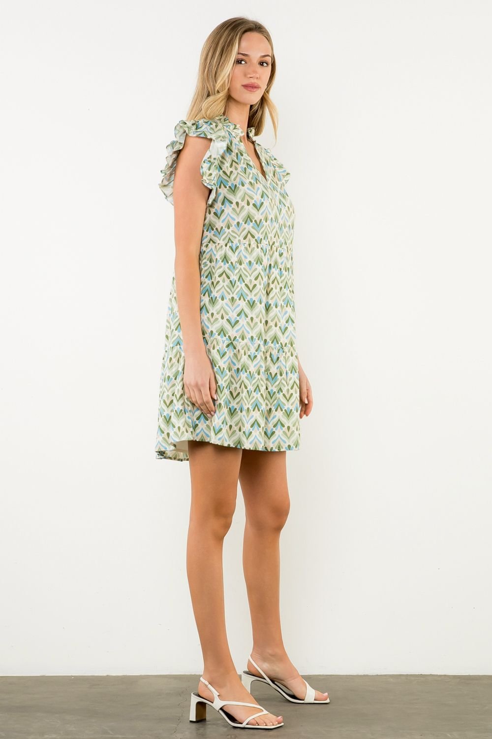 Miller Dress featuring flutter sleeves and floral print, perfect for spring brunches. Available at Port Aransas boutique.