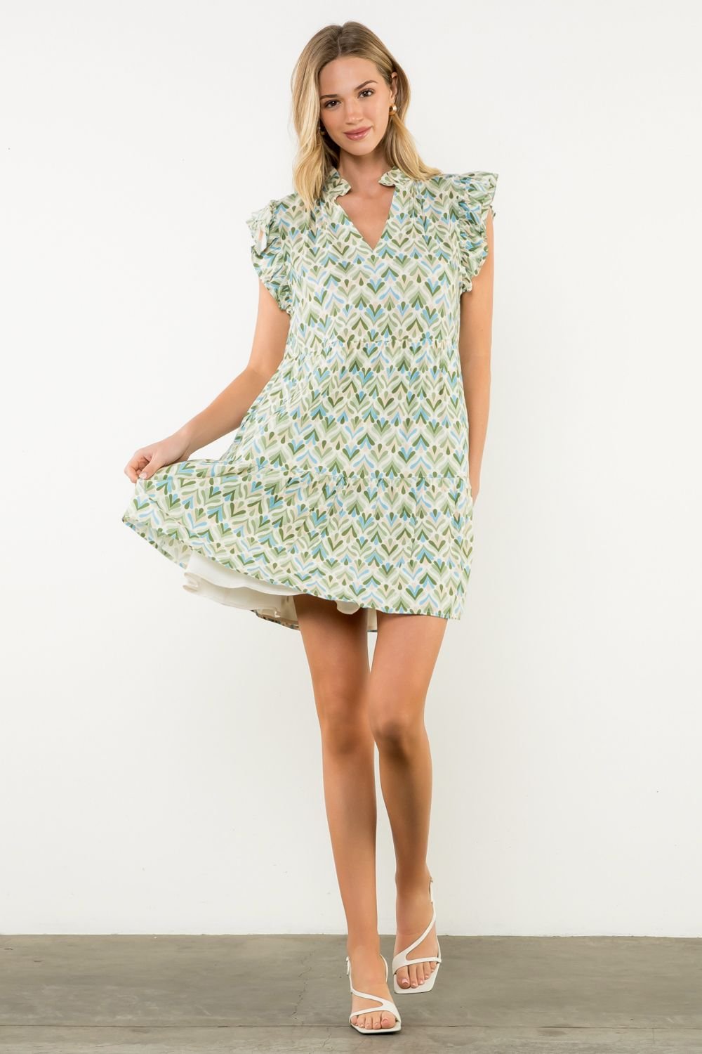 Miller Dress with flutter sleeves, floral print, perfect for brunch or garden parties. Coastal boutique clothing.