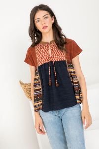 MIXED PRINT TOP worn by model, showcasing trendy coastal style from Raggdoll Boutique.