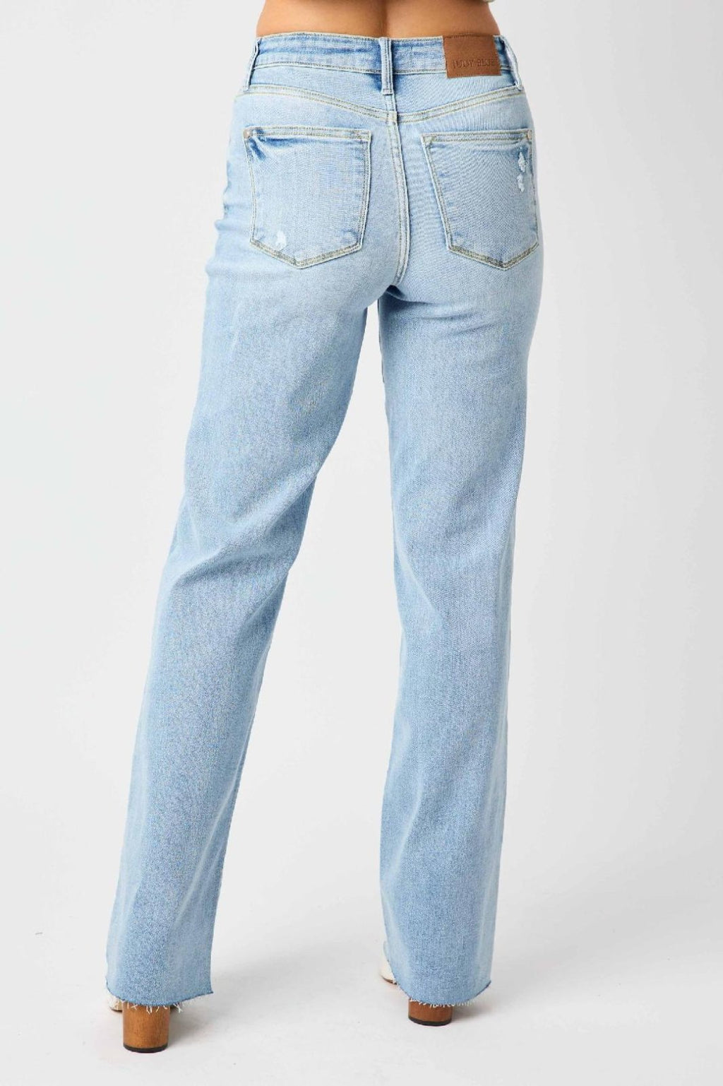 JUDY BLUE HW V FRONT WAISTBAND STRAIGHT FIT (FREY HEM) back view in light blue denim from Raggdoll Boutique.