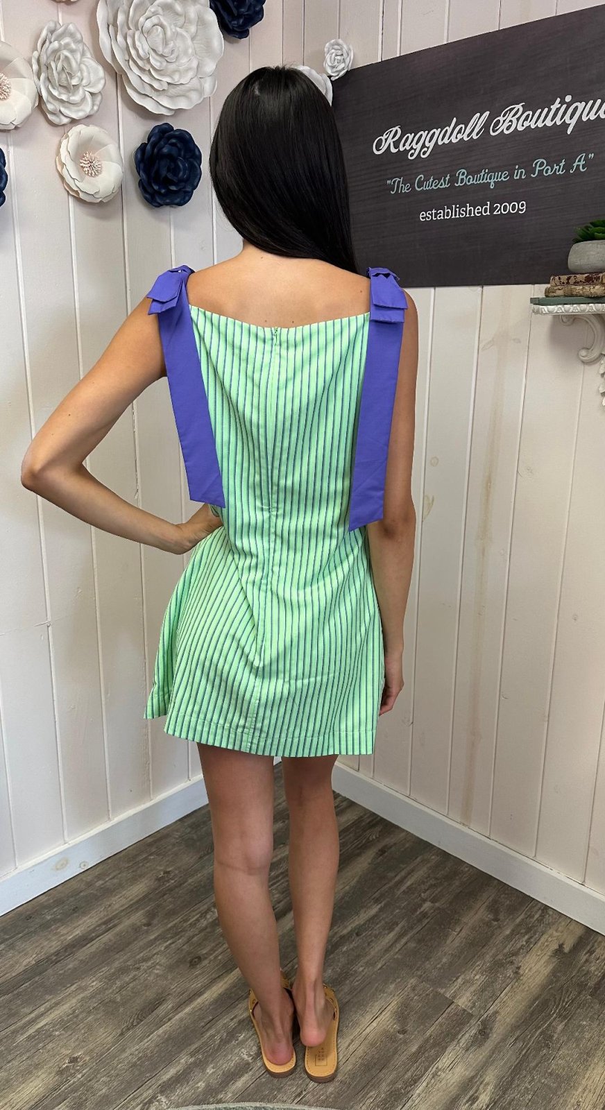 Libby Dress at Raggdoll Boutique showcasing a fashionable green and purple striped design perfect for summer outfits Texas.