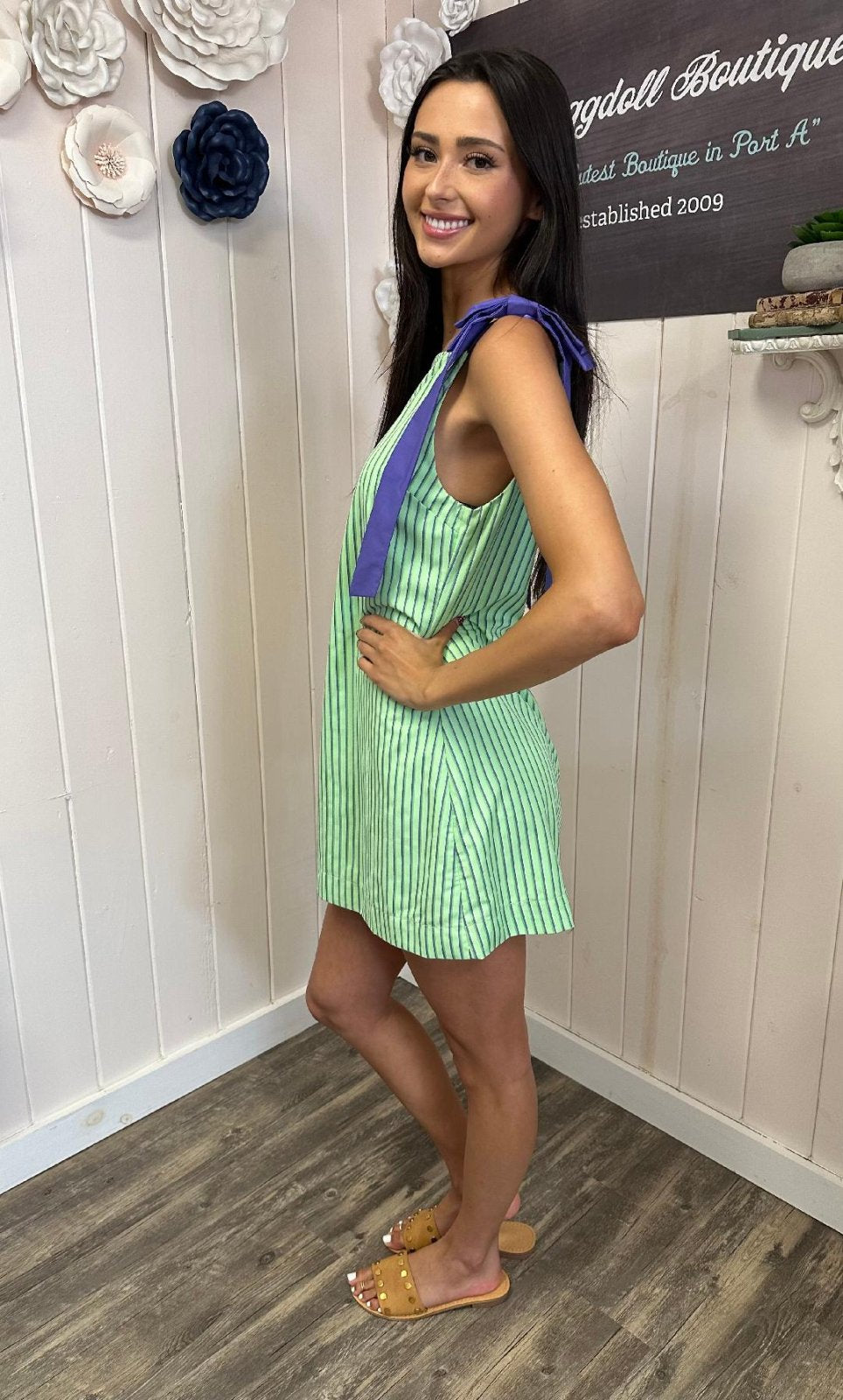 Libby Dress showcased by a model at Raggdoll Boutique in Port Aransas, highlighting trendy coastal style.