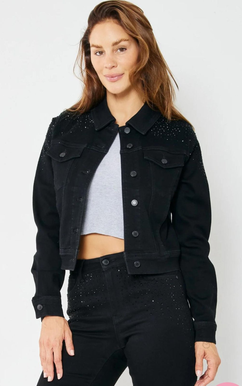 Model wearing JUDY BLUE RHINESTONE EMBELLISHED BLK JACKET, highlighting trendy coastal style from Raggdoll Boutique.