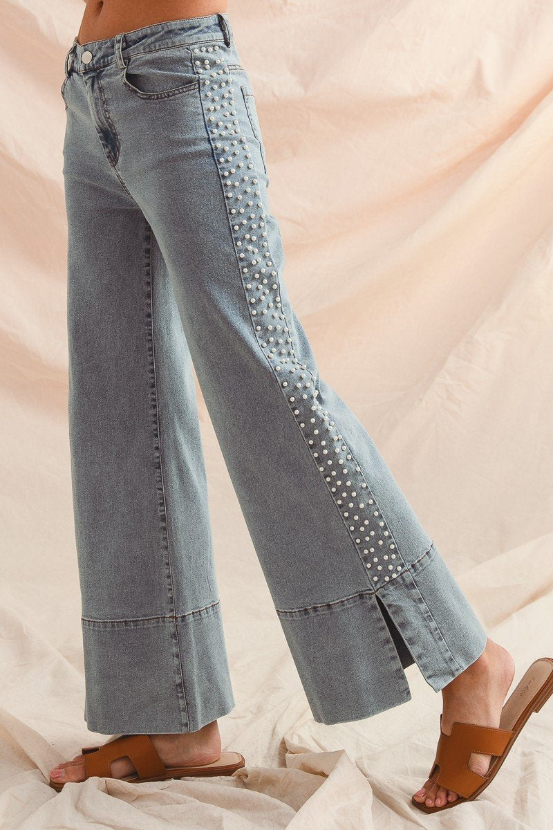 Stylish wide-leg jeans with pearl accents, perfect for curvy plus size fashion at a coastal boutique in Port Aransas.