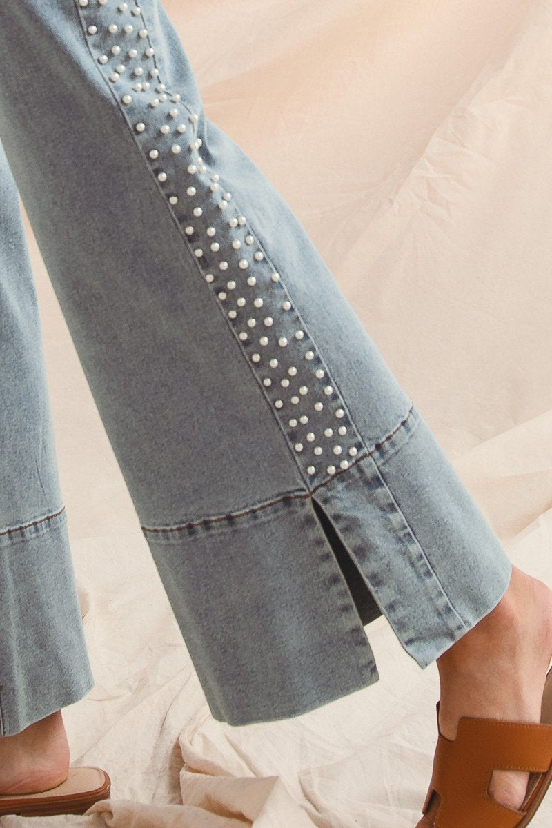 Stylish women's denim pants with pearl embellishments, perfect for coastal boutique clothing and curvy plus size fashion.