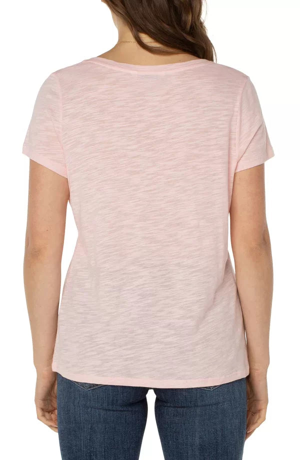 Back view of Liverpool Peony Pink V-neck Tee from Raggdoll Boutique, perfect for summer outfits in Texas.