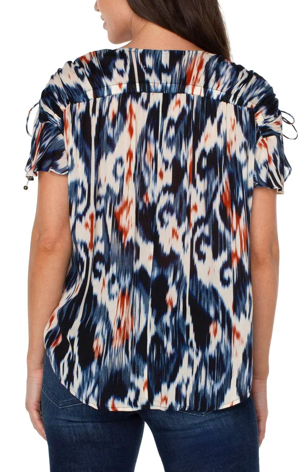 Back view of LP IKAT Dolman Top, 100% Viscose, stylish top from coastal boutique, perfect for tropical vacations.