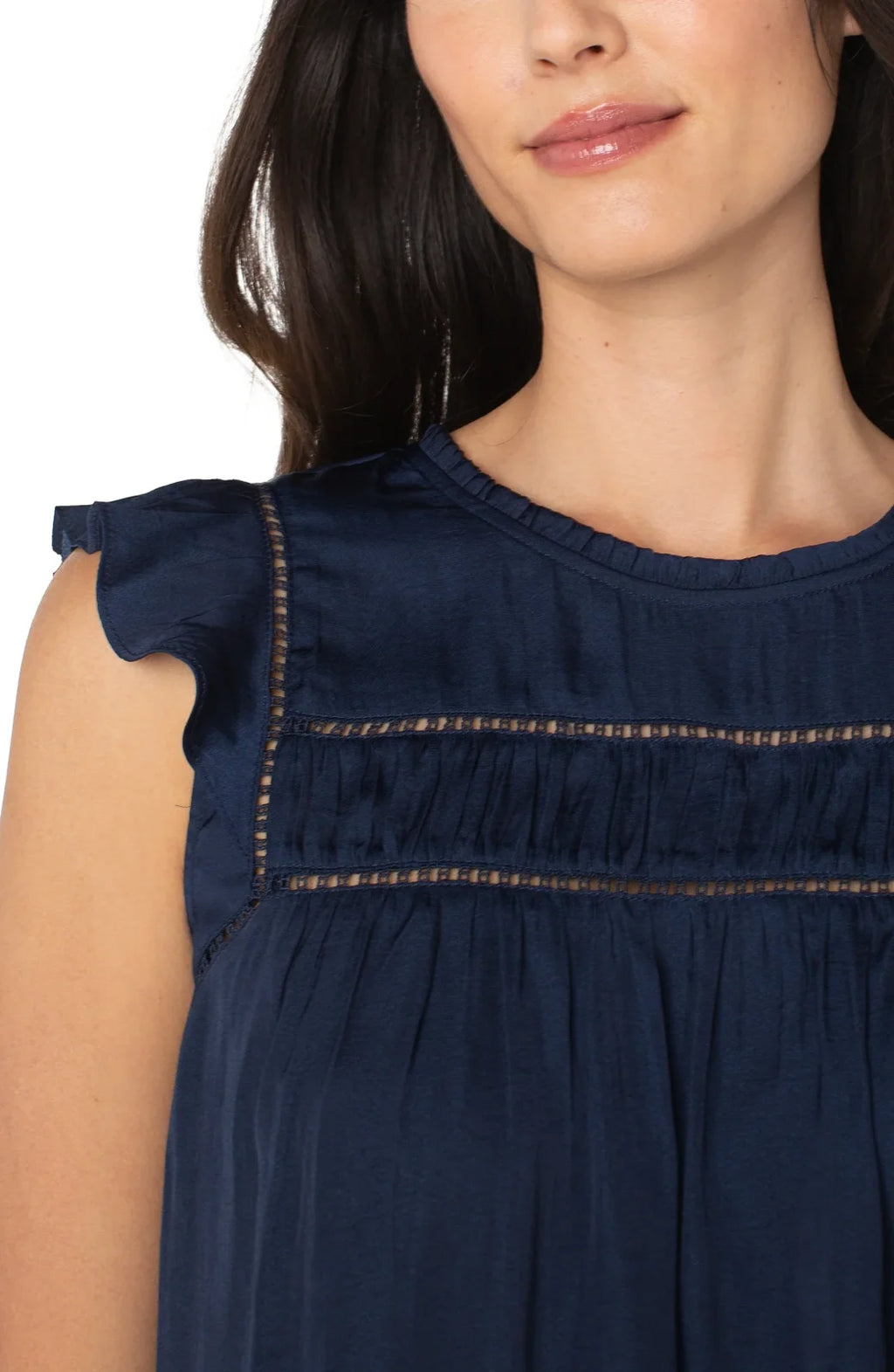 Dark navy flutter sleeve woven top featuring soft draping and delicate shirring, perfect for coastal boutique clothing.
