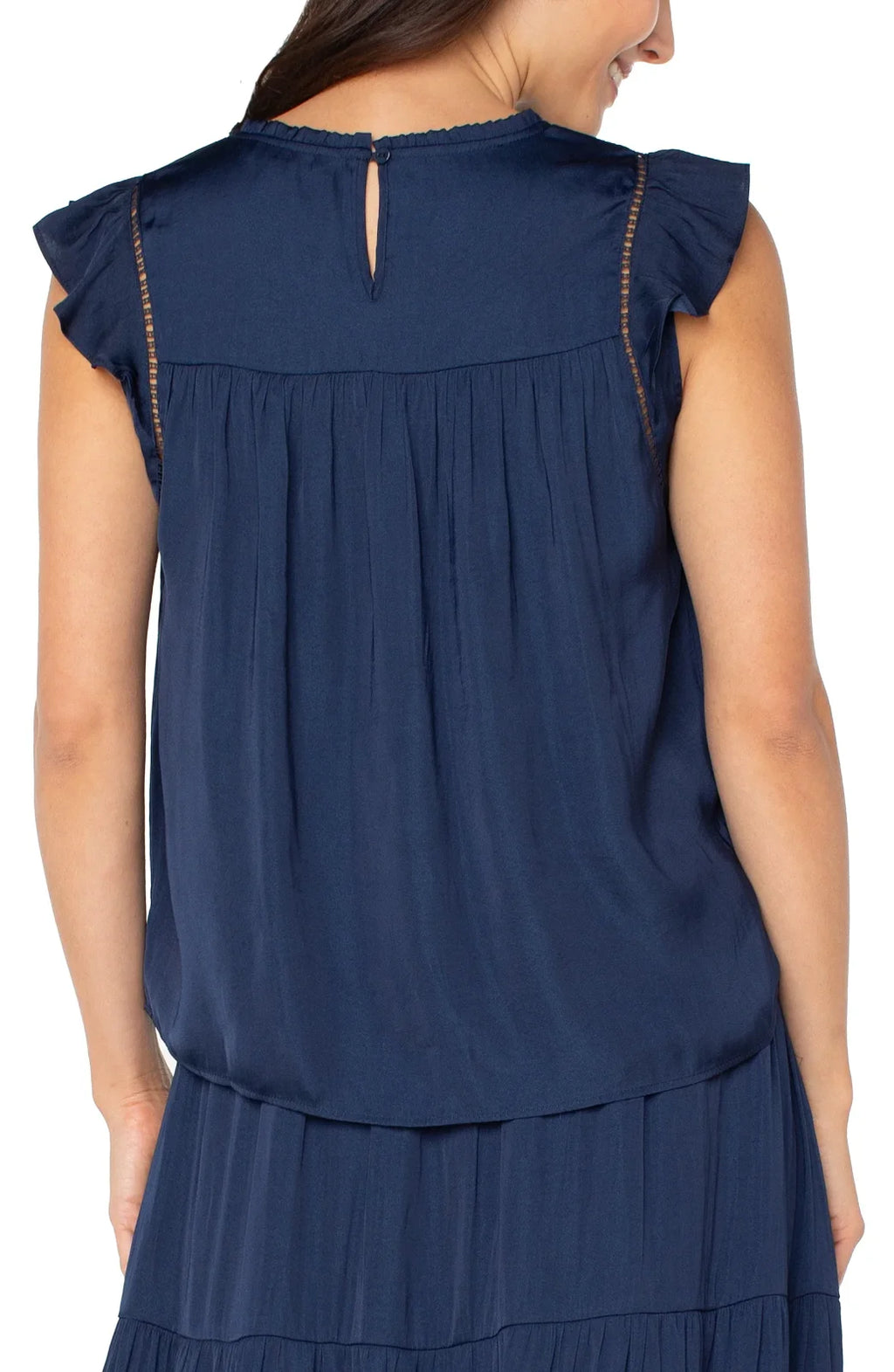Back view of Liverpool dark navy flutter sleeve woven top with keyhole detail. Perfect for coastal boutique clothing and stylish tops.