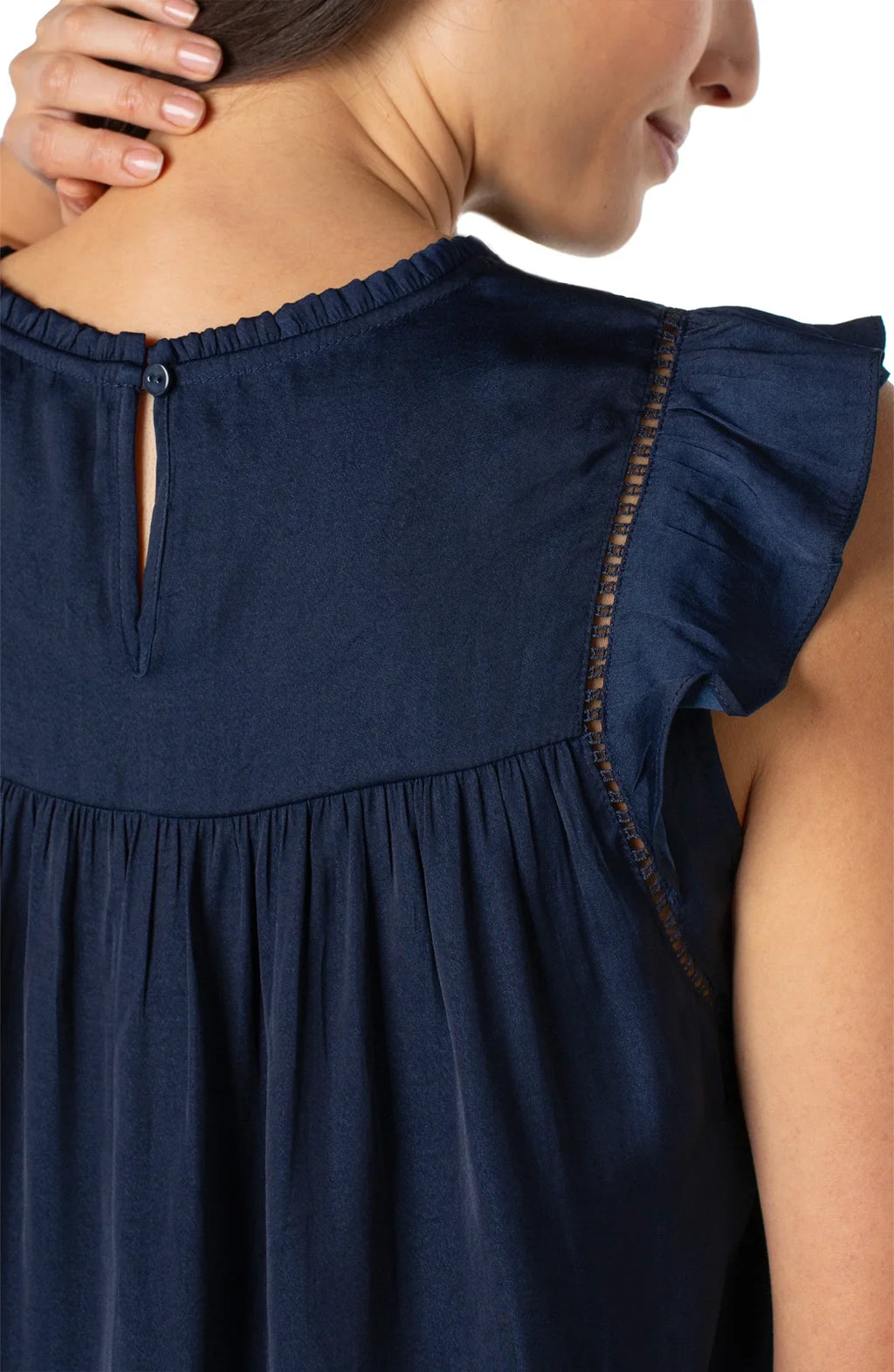 Back view of Liverpool flutter sleeve top in dark navy showcasing delicate shirring and keyhole detail, perfect for coastal boutique clothing.