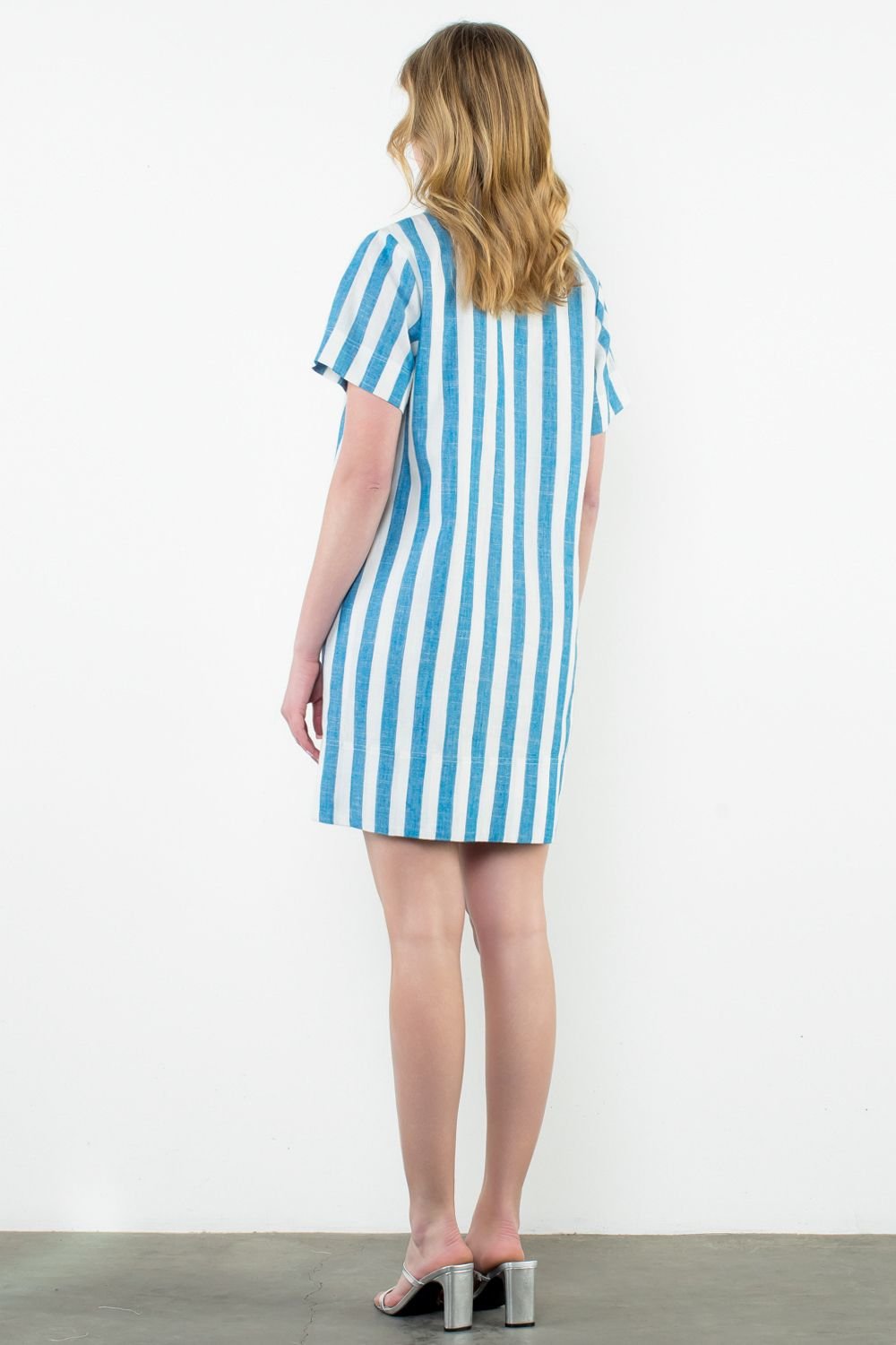 Back view of Peyton Dress with blue and white stripes, perfect for coastal boutique clothing and beach outings.