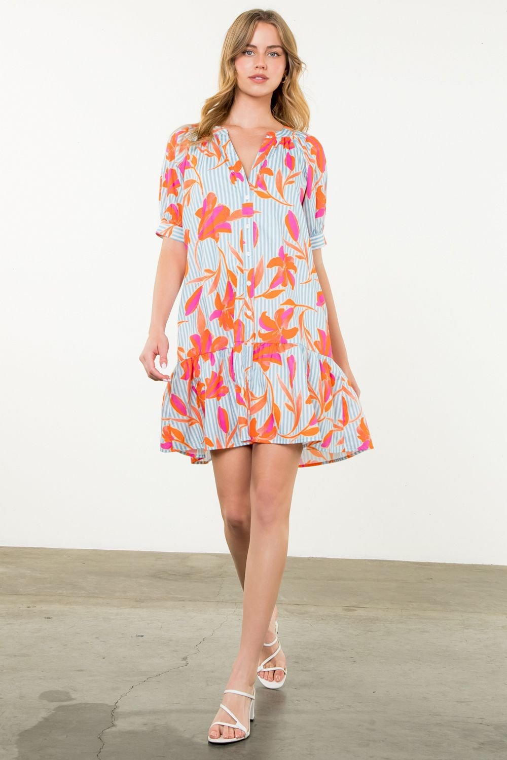 Cameron Dress: a stylish cotton dress with bold flowers and stripes, perfect for coastal brunch dates and summer outings.